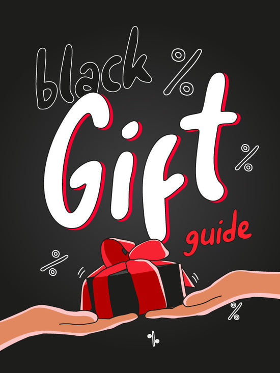 Black gift guide with hands holding a red gift box on a black background