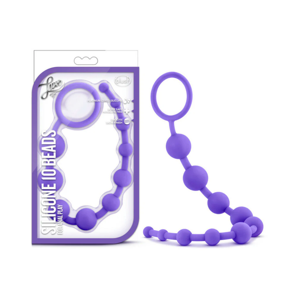 Studio product shot showing the Luxe Silicone 10 Beads for Anal Play package standing next to the purple silicone bead strand on a white background. The packaging features a clear window showcasing the product inside.