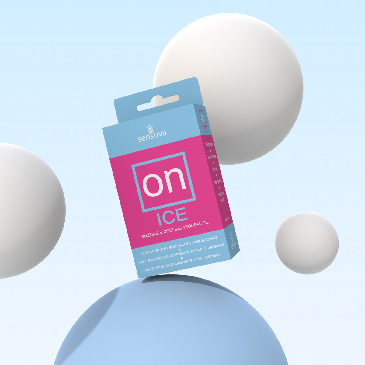 The boxed Sensuva ON ICE Arousal Oil package floats dynamically at an angle on a light blue dome. Smooth white spheres of various sizes hover in the background against a soft pastel sky-blue backdrop.