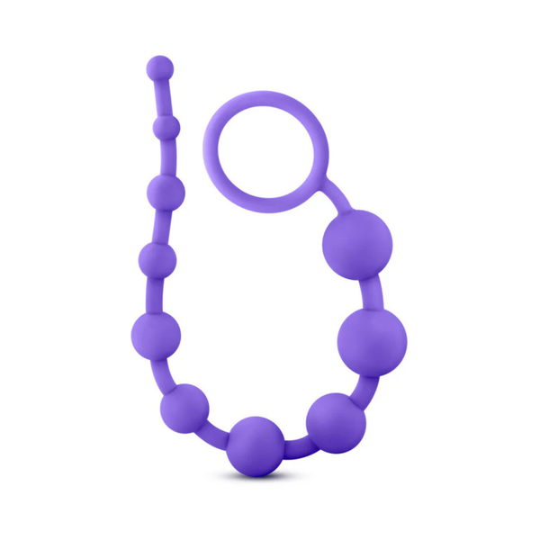 Top-down view of the purple silicone 10-bead strand arranged in a U-shape against a white background. The flexible design features a large ring on one end and a sequence of smooth, connected beads.