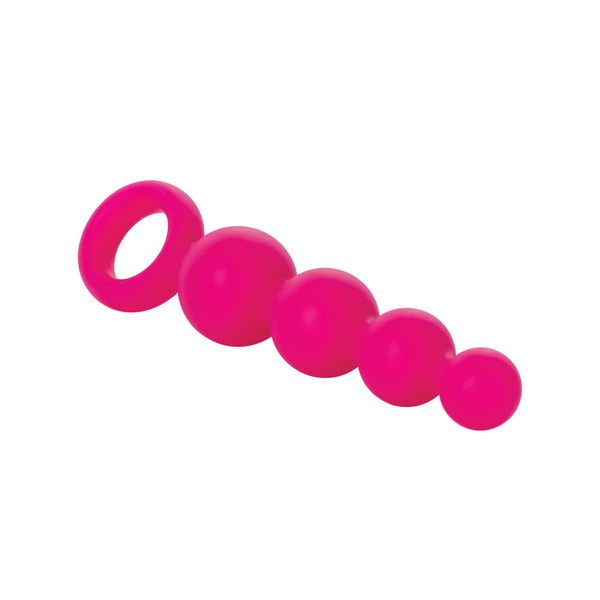 Angled top view of the bright pink silicone anal beads lying diagonally on a white background, highlighting the tapered bead progression.
