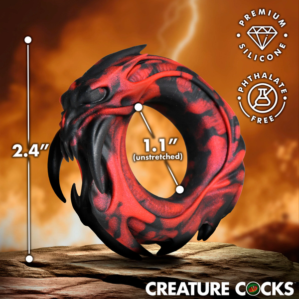 Dimension graphic showing the red and black cock ring resting on a rock surface, indicating an overall height of 2.4" and an unstretched inner diameter of 1.1", along with "Premium Silicone" and "Phthalate Free" badges.