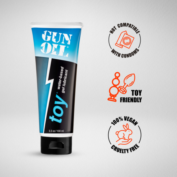 Front product image of 'Gun Oil Toy' lubricant tube with icons indicating it is not compatible with condoms, toy friendly, 100% vegan, and cruelty-free.