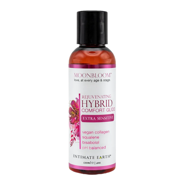 Front studio view of the 120 ml (4 fl oz) amber bottle of Intimate Earth Moon Bloom hybrid comfort glide for extra sensitive skin, featuring magenta floral label accents.