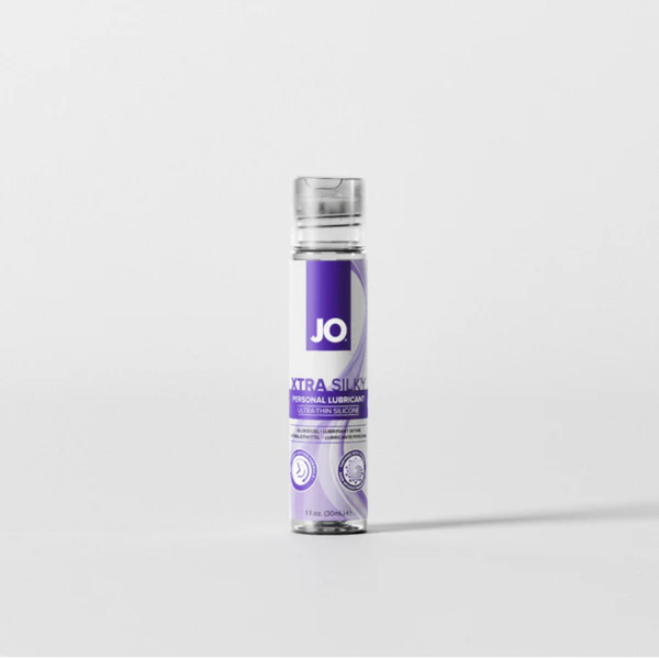 Front view of the smallest 1 fl. oz. (30ml) bottle of JO Xtra Silky Personal Lubricant. The slim clear bottle stands centered against a neutral light grey backdrop.