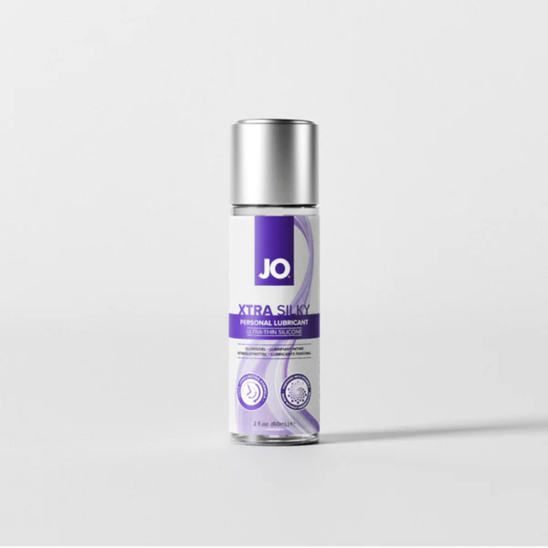 Front view of the medium 2 fl. oz. (60ml) bottle of JO Xtra Silky Personal Lubricant. The bottle features a solid silver cap and signature purple wave graphics on the label.