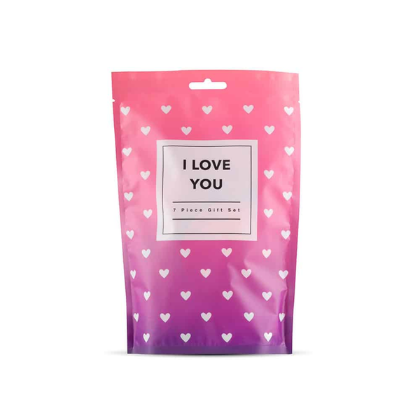 Front view of a pink and purple bag with a white heart pattern, labeled "I LOVE YOU 7 Piece Gift Set."