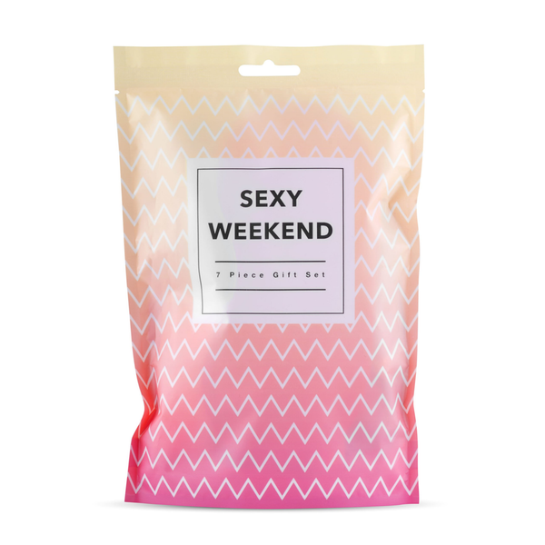 Front view of an orange and pink zig-zag patterned bag, labeled "SEXY WEEKEND 7 Piece Gift Set.