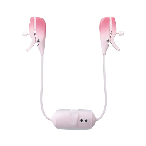 Back view of the pink Lovense Gemini unit detailing its clip mechanism and magnetic charging contacts on the central control hub.