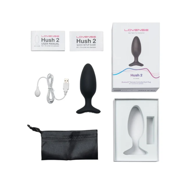 Flat-lay collection photo showing the Lovense Hush 2 butt plug, box, user manual, quick setup guide, USB charging cable, satin storage pouch, and packaging insert.