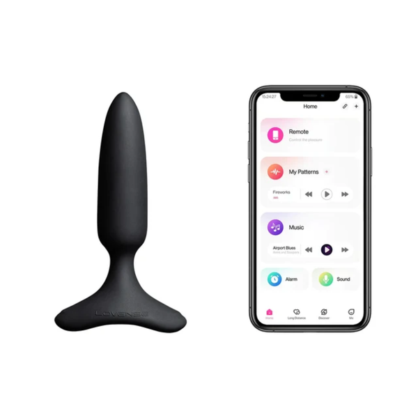 Studio product shot of the black Lovense Hush 2 vibrating butt plug displayed alongside a smartphone showing the Lovense remote control app interface.