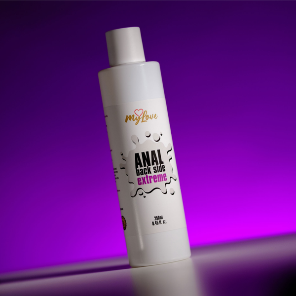 Front view of the 250 ml MyLove Anal Back Side Extreme bottle, angled slightly on a white surface against a bright purple backlit background.