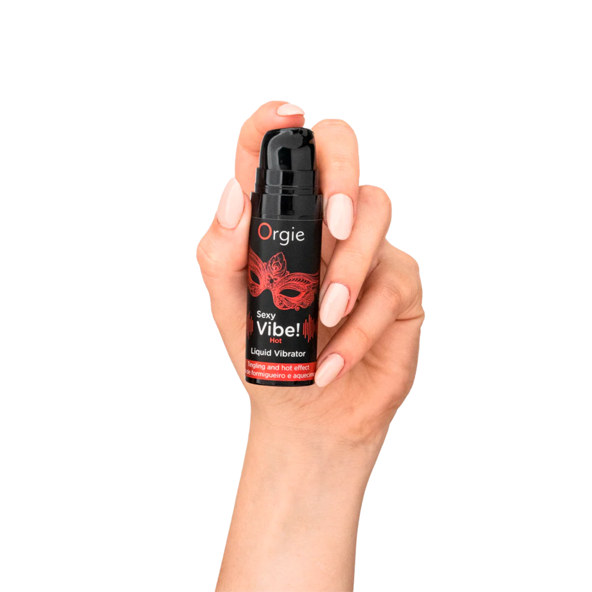A person's hand with light pink nails holding the small black pump bottle of Orgie Sexy Vibe! Hot Liquid Vibrator with a red mask design.