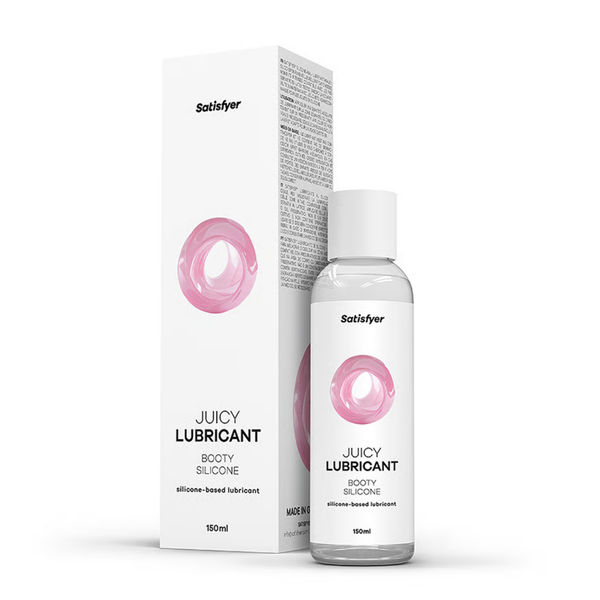 Product packaging shot showing the 150 ml Satisfyer Juicy Lubricant Booty Silicone clear bottle standing next to its white box featuring pink ring accents.