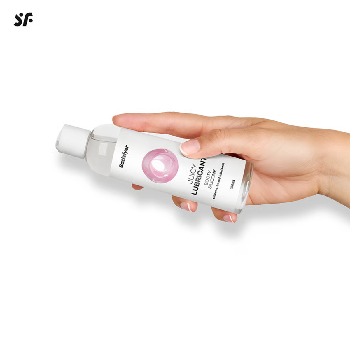 Studio photo showing a hand holding the 150 ml bottle of Satisfyer Juicy Lubricant Booty Silicone horizontally against a white background.