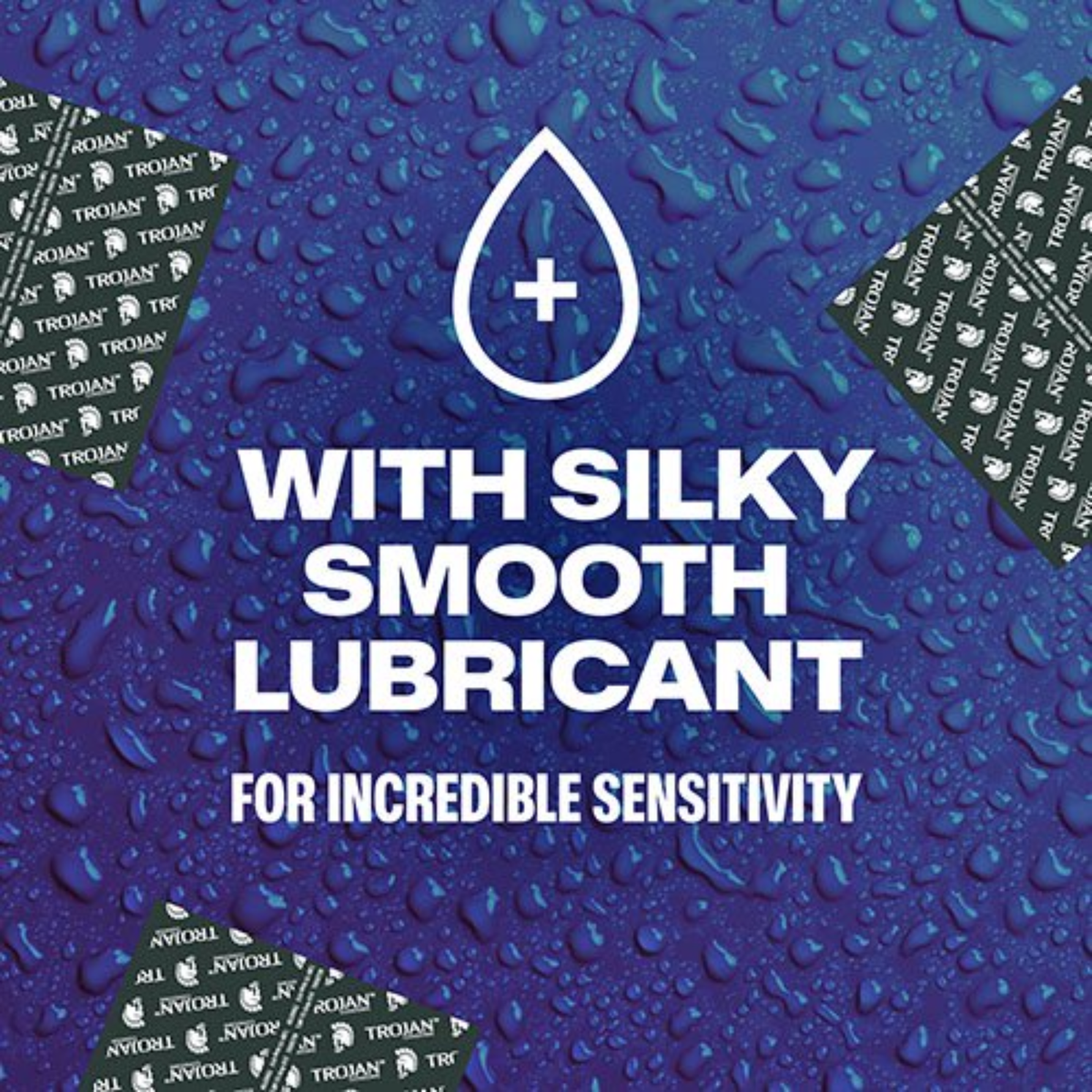 A marketing graphic featuring a dark blue background covered in realistic water droplets to represent lubrication. In the center is a white droplet icon containing a plus sign, above the text "WITH SILKY SMOOTH LUBRICANT FOR INCREDIBLE SENSITIVITY." Three black Trojan-branded individual condom foil wrappers are arranged around the corners of the frame.