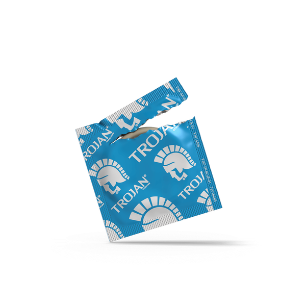Open Trojan ENZ condom wrapper in a white background.