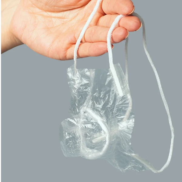 Hand holding UNIQ Multi condom with pull strips for easy use