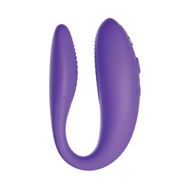 Isolated side profile view of the C-shaped, light purple silicone We-Vibe Sync Go couples massager, detailing the textured ridges on its inner arm.