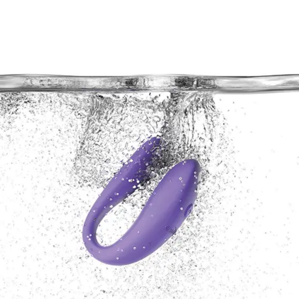 Action shot showing the light purple We-Vibe Sync Go massager splashing into clear water to demonstrate its IPX7 waterproof design.