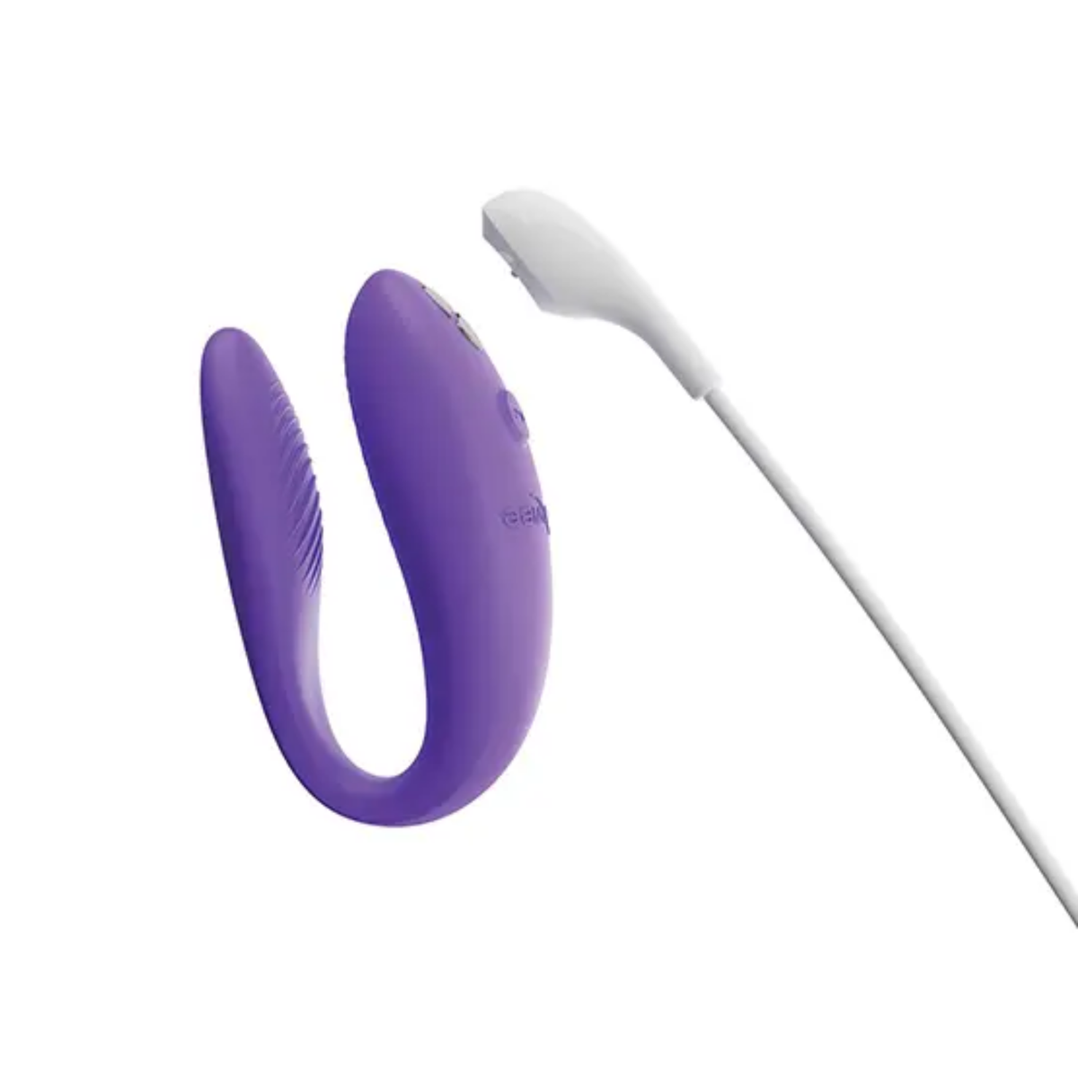 Product view of the light purple We-Vibe Sync Go massager alongside its white magnetic USB charging cable.
