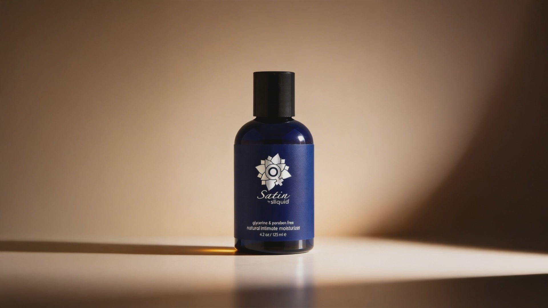 A clip of Sliquid Satin Natural Intimate Moisturizer bottle.